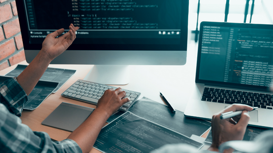 An image of someone working and looking at a computer screen; image used for blog post about businesses deducting computer software costs