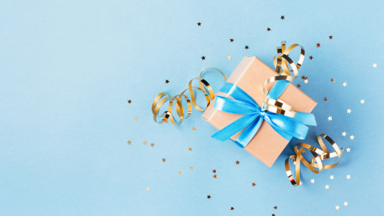 A photo of a gift box tied with a bow and ribbon; for blog post about gift tax exclusion